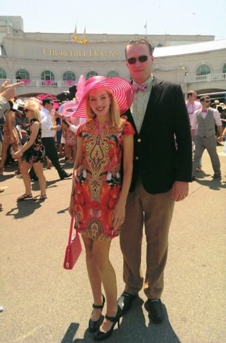man and woman posing at the Kentucky Derby
